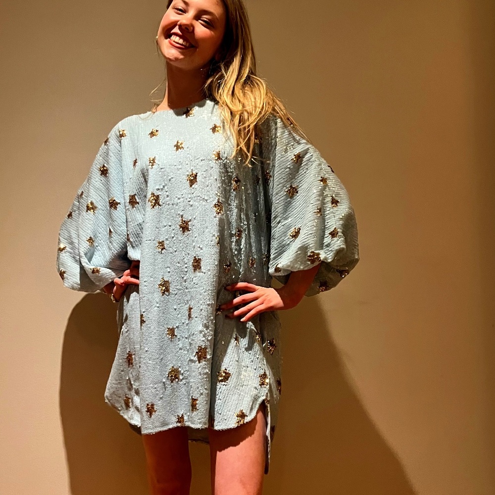 Pale blue sequined party dress with gold stars
